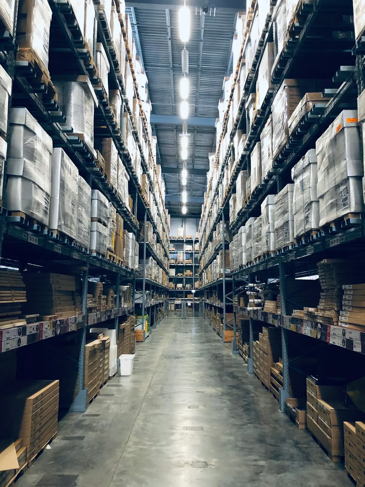 Warehouse aisles stocked with goods ready for shipping